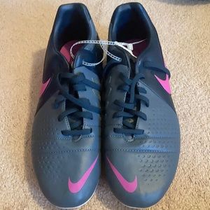 Gray and pink Nike cleats
